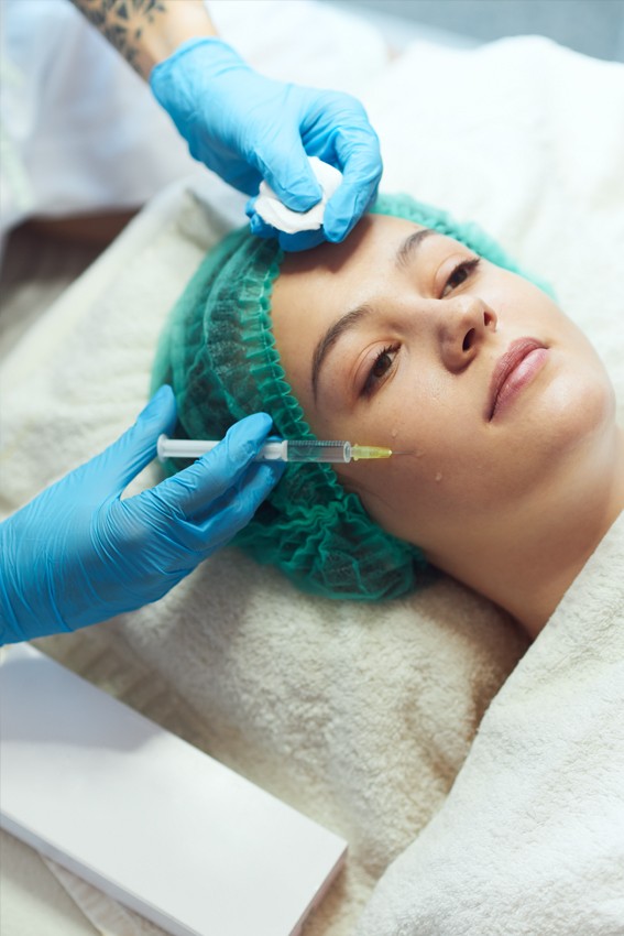 asian woman with plastic surgery lines on face isolated on grey